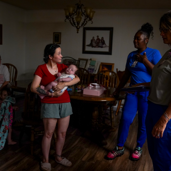 People stand in home talking