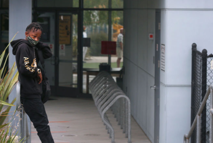 Child waiting for school during COVID-19