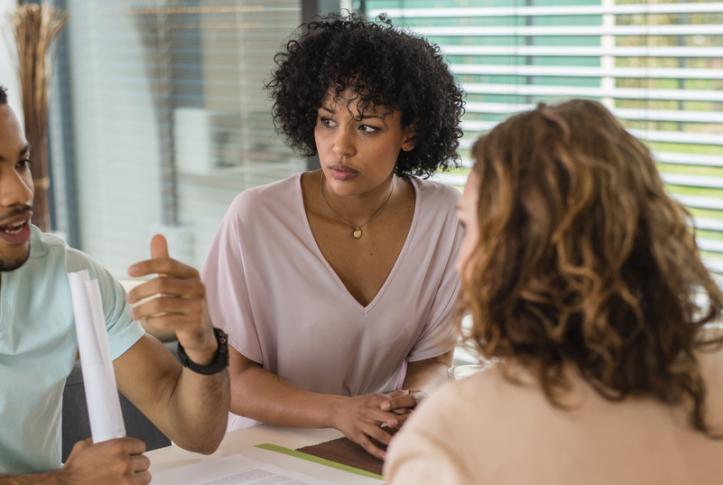 Consumer discussing health insurance choices with an agent