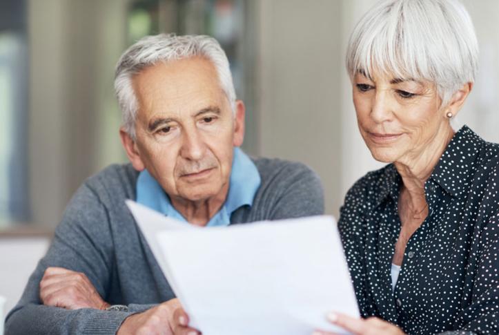 Medicare beneficiaries going over paperwork