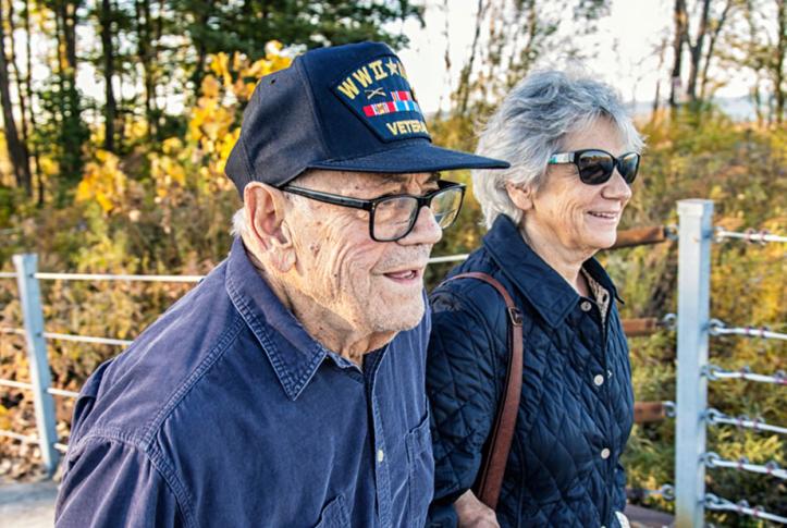 Medicare beneficiary and baby boomer daughter walking