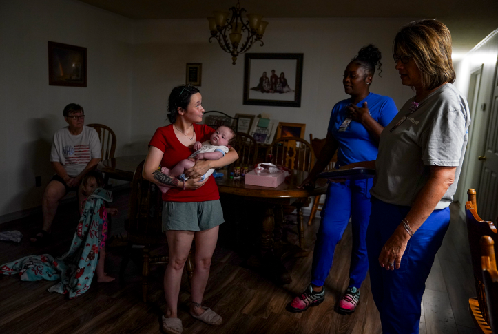 People stand in home talking