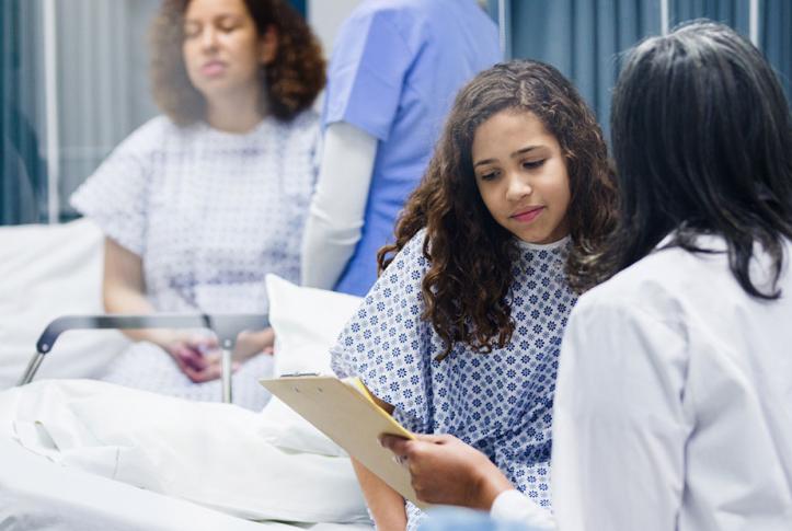 patient in hospital talking to doctor