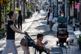 Women walk on street in Tokyo